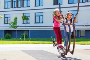 Image of joyful friends having fun on playground outdoors photo