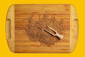 Background of whole mustard seeds. Mustard is widely used in many national cuisines. photo