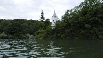 Storage reservoir Velka Domasa, church on the lake, river Ondava, Slovakia video