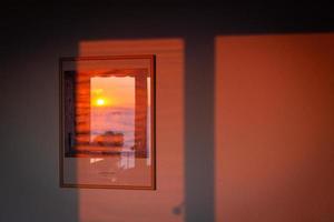 Shadows in the window in the light of the rising sun photo