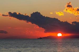 Sunset with dark clouds photo