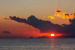 Sunset with dark clouds photo