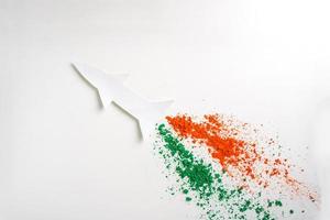 Concept for Indian Independence day and republic day, view of flying missile with tricolor on white background photo
