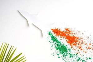Concept for Indian Independence day and republic day, view of flying missile with tricolor on white background photo