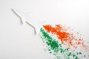 Concept for Indian Independence day and republic day, view of flying missile with tricolor on white background photo