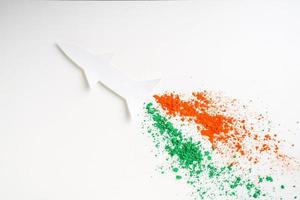 Concept for Indian Independence day and republic day, view of flying missile with tricolor on white background photo