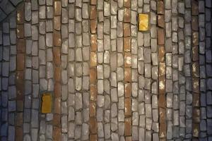 Tiles on wall. Mosaic tile. Pattern of shards of colored stone. photo