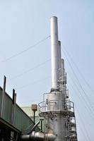 Industrial factory smokestacks that release toxic fumes into the atmosphere photo