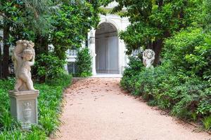 Milan, Italy - Italian Villa entrance with garden. Luxurious green exterior. photo