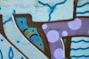 Background image of the wall decorated with colorful abstract graffiti. Street art concept photo
