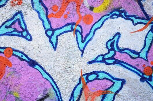 Texture of a fragment of the wall with graffiti painting, which is depicted on it. An image of a piece of graffiti drawing as a photo on street art and graffiti culture topics