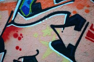Background image of the wall decorated with colorful abstract graffiti. Street art concept photo