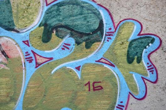 Texture of a fragment of the wall with graffiti painting, which is depicted on it. An image of a piece of graffiti drawing as a photo on street art and graffiti culture topics