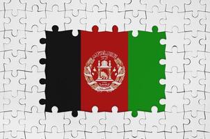 Afghanistan flag in frame of white puzzle pieces with missing central part photo