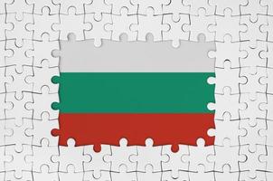 Bulgaria flag in frame of white puzzle pieces with missing central part photo