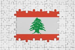 Lebanon flag in frame of white puzzle pieces with missing central part photo