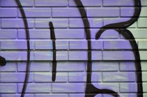 Background image of the wall decorated with colorful abstract graffiti. Street art concept photo