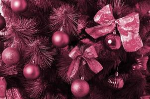 Christmas tree details Image toned in Viva Magenta, color of the 2023 year photo