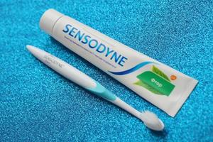 KYIV, UKRAINE - MAY 4, 2022 Sensodyne fluorine or fluor is a daily fluoride toothpaste photo