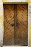 Old ancient wooden door texture in european medieval style photo