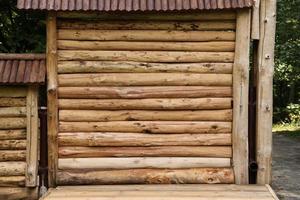 Log cabin barn unpainted debarked wall textured horizontal background photo