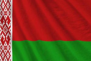 Belarus flag with big folds waving close up under the studio light indoors. The official symbols and colors in banner photo