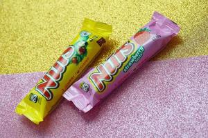 KYIV, UKRAINE - MAY 4, 2022 Nuts original chocolate bar manufactured by Nestle company photo