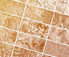 A set of many small fragments of tagged walls. Graffiti vandalism abstract background collage in vintage tones photo