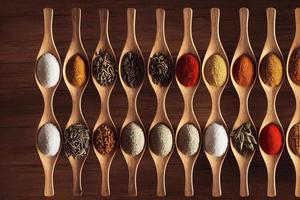 Cooking table with spices and herbs photo