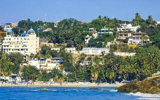 Puerto Escondido Oaxaca Mexico 2022 Sun beach people waves and boats in Puerto Escondido Mexico. photo