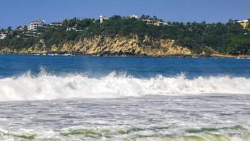 Extremely huge big surfer waves at beach Puerto Escondido Mexico. photo