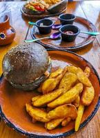 Fast food in the restaurant hamburger and fries in Mexico. photo