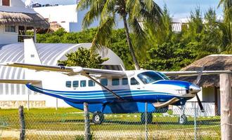 Propeller plane at small airport on Holbox island Mexico. photo