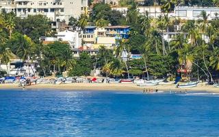 Puerto Escondido Oaxaca Mexico 2022 Sun beach people waves and boats in Puerto Escondido Mexico. photo