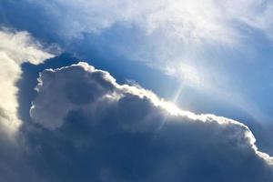 The sun comes out from behind the clouds in Mexico. photo