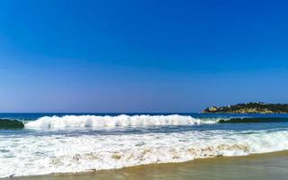 Extremely huge big surfer waves at beach Puerto Escondido Mexico. photo