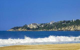 Extremely huge big surfer waves at beach Puerto Escondido Mexico. photo