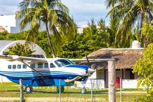 Propeller plane at small airport on Holbox island Mexico. photo