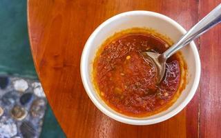 Spicy red Mexican chili sauce in Puerto Escondido Mexico. photo