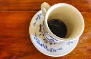 Blue white cup pot with black coffee wooden table Mexico. photo