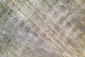 Empty farming land after harvesting, agriculture season aerial view photo