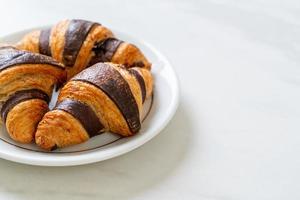 fresh croissant with chocolate photo
