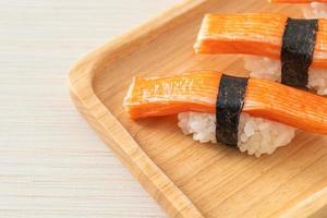 Crab Stick Sushi on wood plate photo