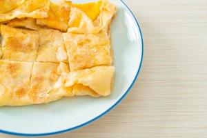 roti with egg and sweetened condensed milk photo