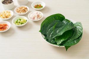 Miang kham - A royal leaf wrap appetizer photo