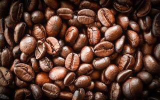 Close up of Coffee beans roasted texture background - top view photo