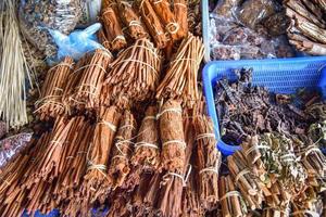 Herbal Medicines from nature root tree bark branch of dry leaf for sale in the local asia photo