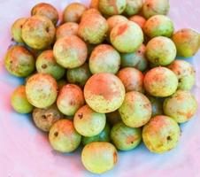 Indian gooseberry on plate background Fruit of herbs and medicinal photo