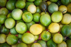 Green and yellow fresh passion fruits harvest from garden Passiflora foetida photo