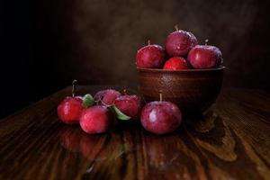 Clay plate with red apples. Red ripe apples. photo